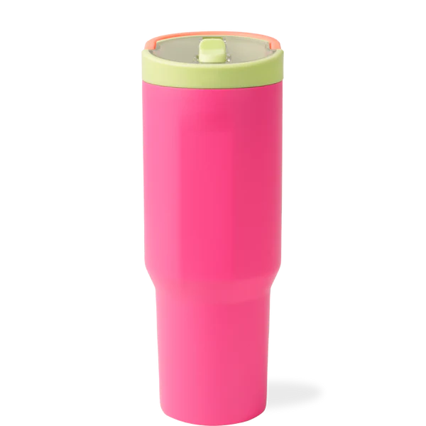 Pink tumbler with a green lid on a white background