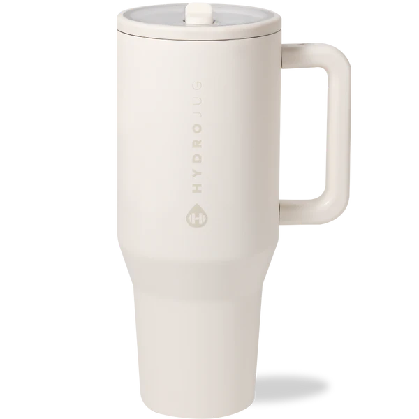 White travel mug with a lid on a white background