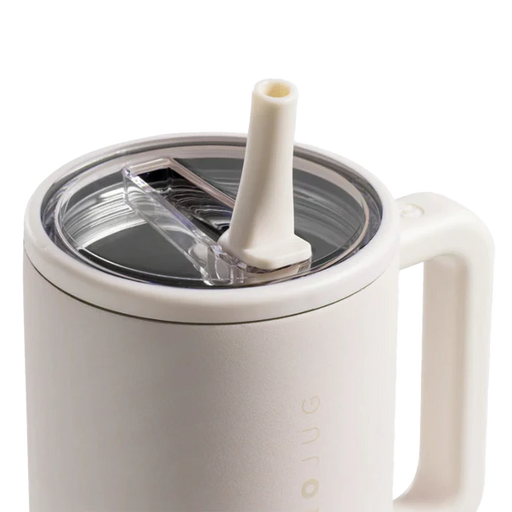White mug with straw lid on a white background