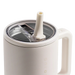 White mug with straw lid on a white background