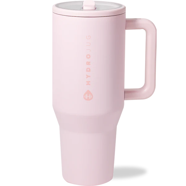 Pink travel mug with handle on a white background