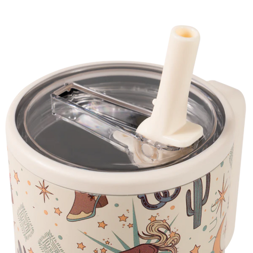 Tumbler with cowboy design, straw, and clear lid on a white background