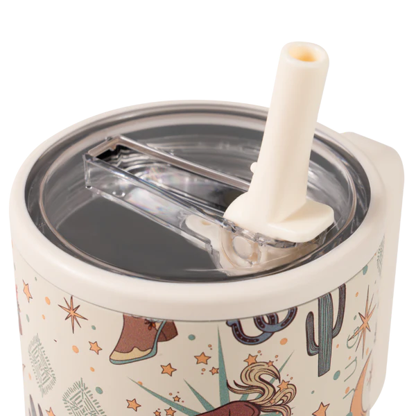 Tumbler with cowboy design, straw, and clear lid on a white background