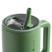 Green mug with straw lid on a white background