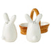 Two white rabbit-shaped salt and pepper shakers with a woven basket on a white background
