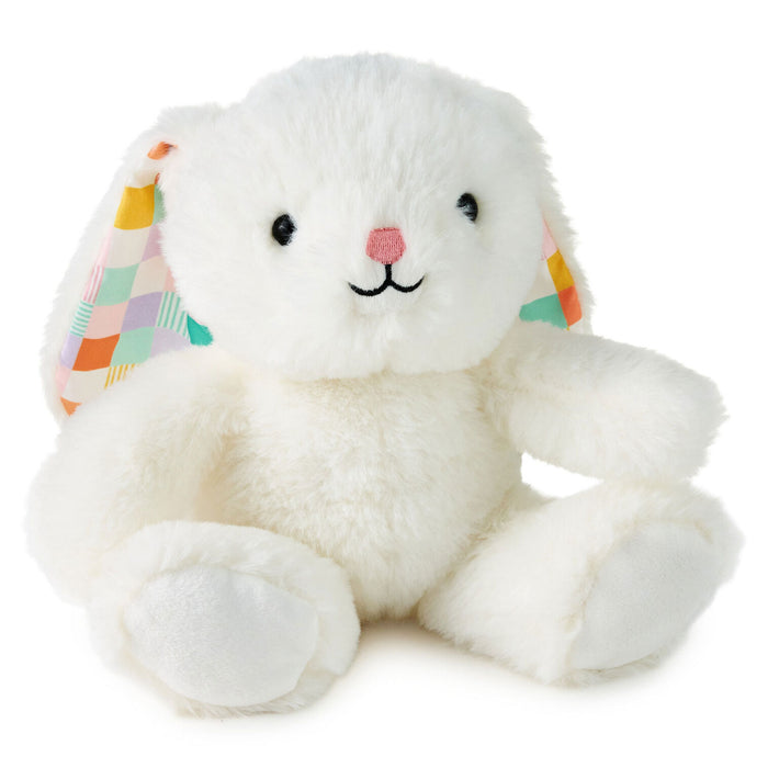 White plush bunny with colorful checkered ears on a white background