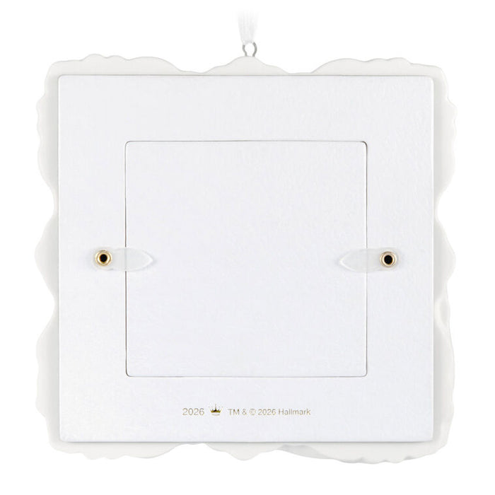 White decorative wall clock with scalloped edge on a white background
