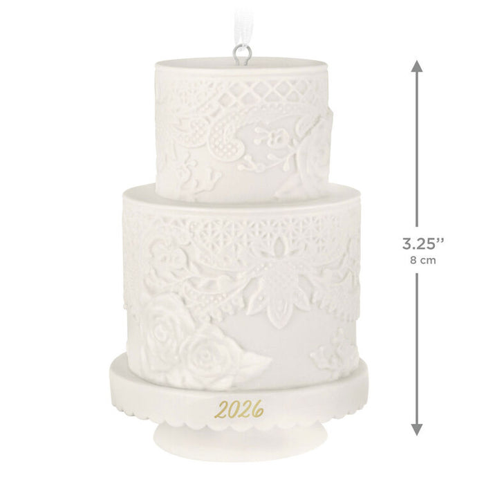 White textured cake-shaped ornament with '2026' on a white background