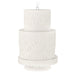 White embossed candle on a white background