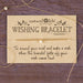 Wishing bracelet with instructions on a wooden background