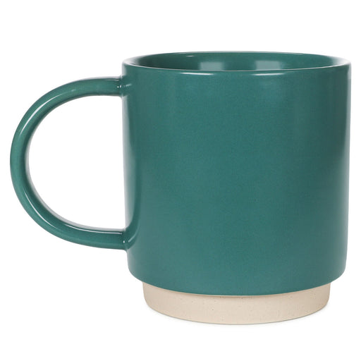 Teal mug with a beige base on a white background