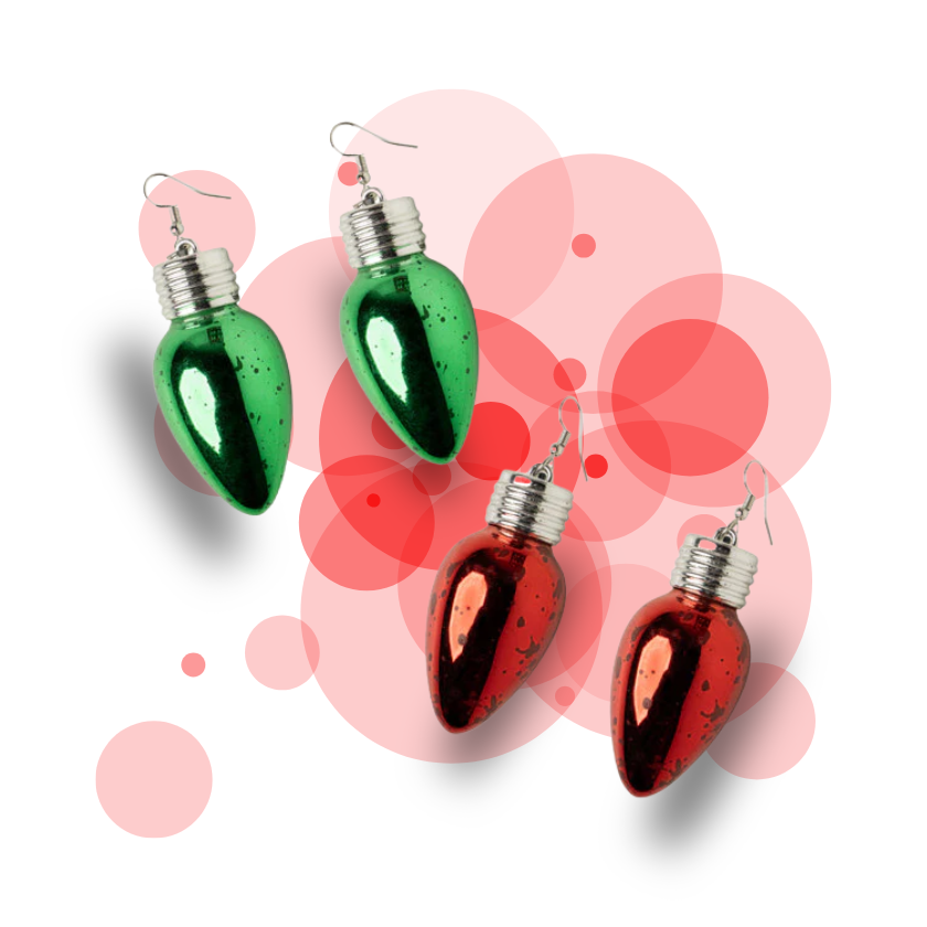 Green and red Christmas bulb earrings on a colorful background