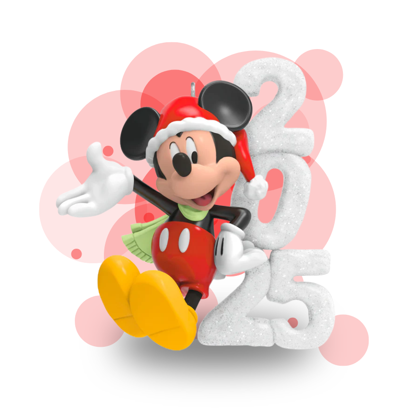 Mickey Mouse figurine in a Santa hat with a snowman and number two on a white background