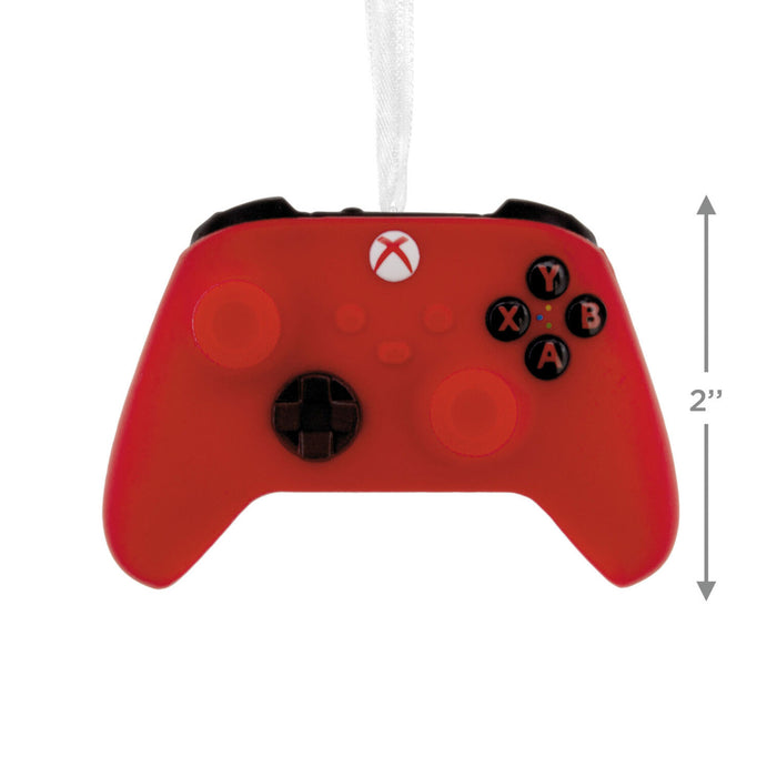 A red Xbox-style game controller ornament with a white hanging ribbon, shown on a white background with a 2-inch height measurement marker on the right.