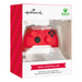 A red Xbox controller Christmas tree ornament displayed inside its retail packaging, featuring the Hallmark and Xbox logos on a white and red box.