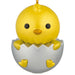 Yellow chick figurine hatching from an egg on a white background