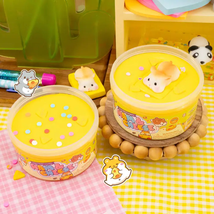 Two yellow containers with cartoon designs on a checkered tablecloth.