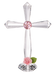 Crystal cross with pink gem and rose on a white background