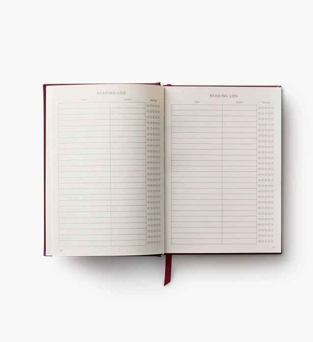 Open notebook with a reading log on a white background