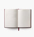 Open notebook with lined pages on a white background