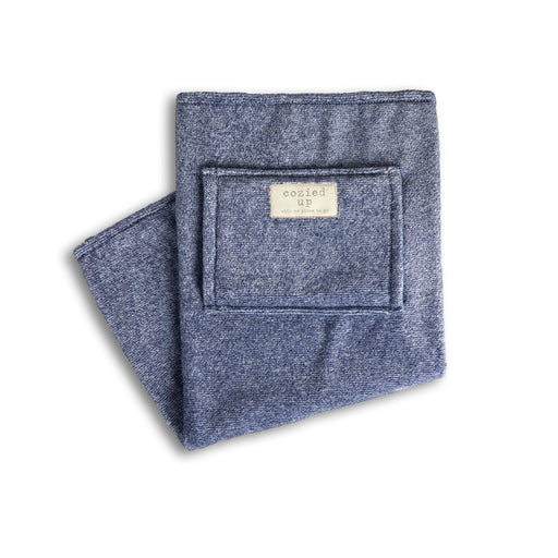 Folded denim-like fabric with a label on a white background