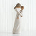Statue of a mother holding a child against a white background
