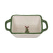 Rectangular ceramic dish with green handles and a Christmas tree design on a white background