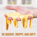 Hand holding yellow gooey substance with text 'So squishy, drippy, and soft!' on a blurred background