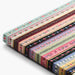 Set of colorful fabric strips with floral patterns on a white background