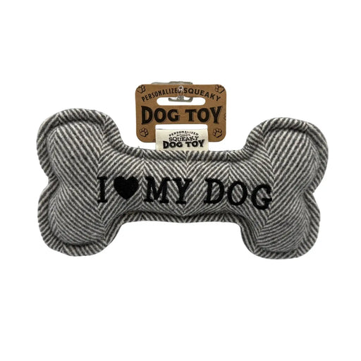 Bone shaped dog toy that says 'I LOVE MY DOG' on a white background
