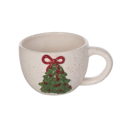 White ceramic mug with a Christmas tree and red bow design on a white background