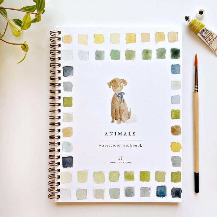 Watercolor workbook titled 'Animals' with a dog illustration on a white surface.