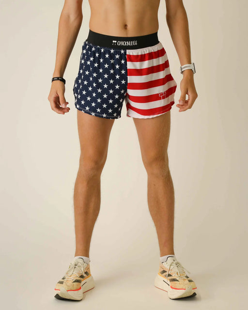 Person wearing American flag-themed athletic shorts on a plain background