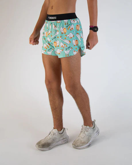 Person wearing a patterned teal underwear with a white background