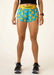 Person wearing blue shorts with yellow rubber duck pattern and yellow waistband on a white background