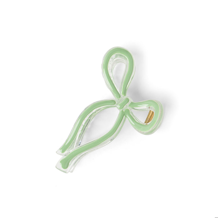 Green hair clip on a white background