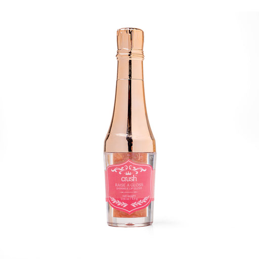 Rose gold lip gloss with pink label on a white background