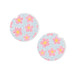 Pair of round earrings with pink floral design on a light blue background