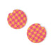 Pair of round earrings with pink and yellow houndstooth pattern on a white background