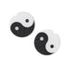 Yin and yang symbol earrings on a white background