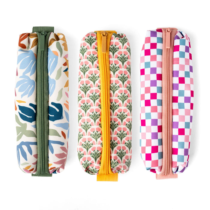 Three colorful patterned pouches with zippers on a white background