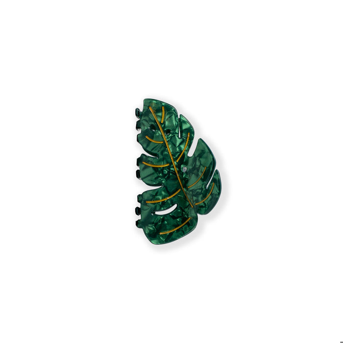 A green translucent leaf-shaped hair claw clip with gold metallic vein detailing, shown on a plain white background.