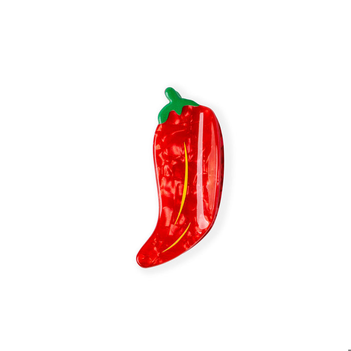 Red pepper-shaped object with green stem on a white background
