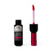 Lip gloss with black container and red applicator on a white background