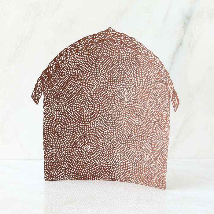 Arched, rust-colored pierced-metal backdrop, patterned with branches and swirling circles of dots. Sized to complement The Holy Family nativity set