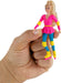 Hand holding a small figurine of a character in a pink dress with blue and yellow accents.