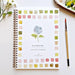 Watercolor workbook titled 'Flowers' with color swatches on a white surface.
