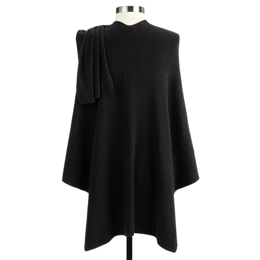 Black cape on a mannequin against a white background