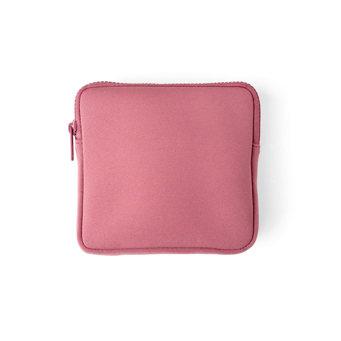 A dusty pink neoprene tablet sleeve with a top zipper and matching zipper pull, shown flat on a white background.