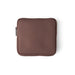 Brown zippered pouch on a white background